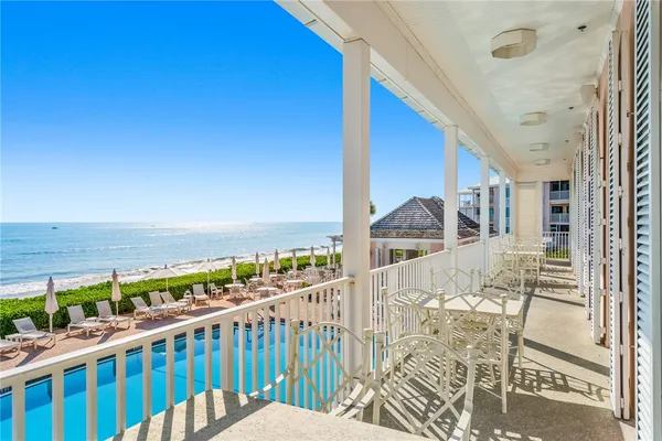 a view of a swimming pool with a balcony