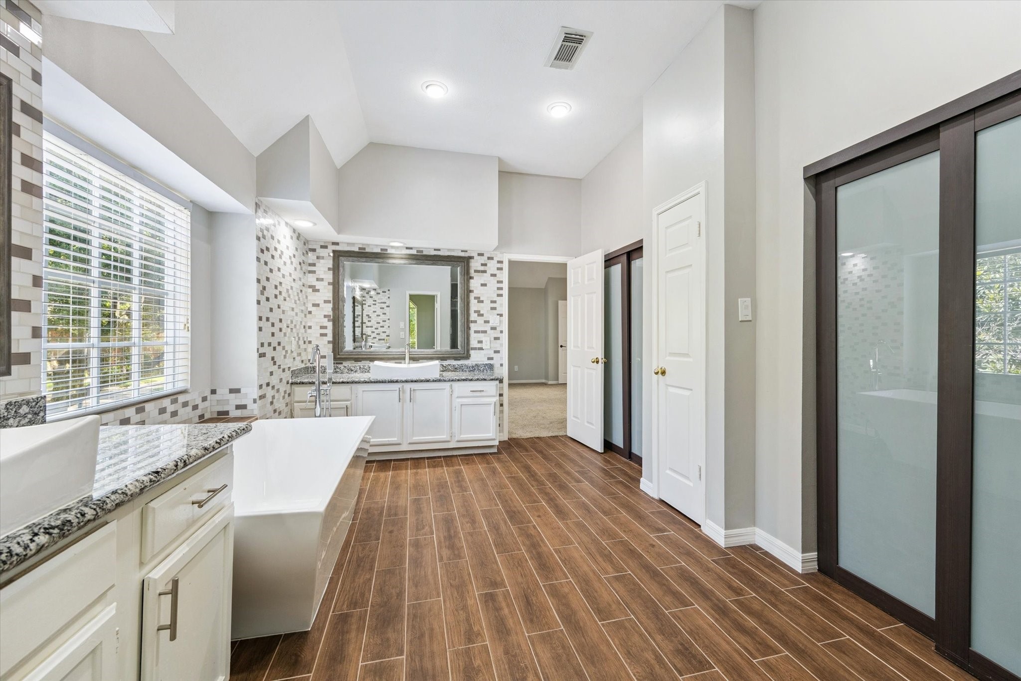 2006 Raven's Crest Drive Sugar Land, TX 77478 - Photo 15 of 29 a large white kitchen with a large window