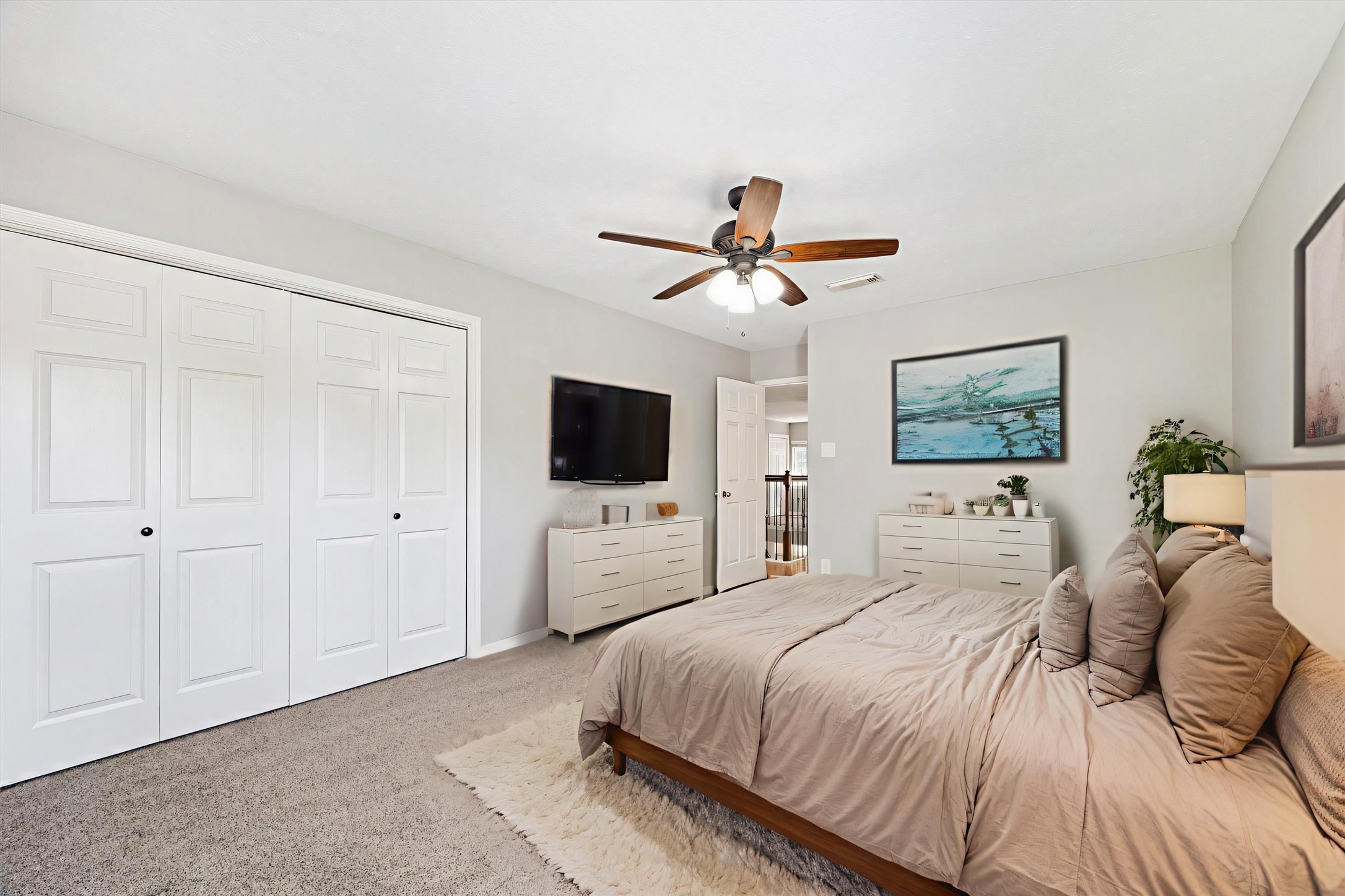 2006 Raven's Crest Drive Sugar Land, TX 77478 - Photo 19 of 29 a bedroom with a bed and a flat screen tv