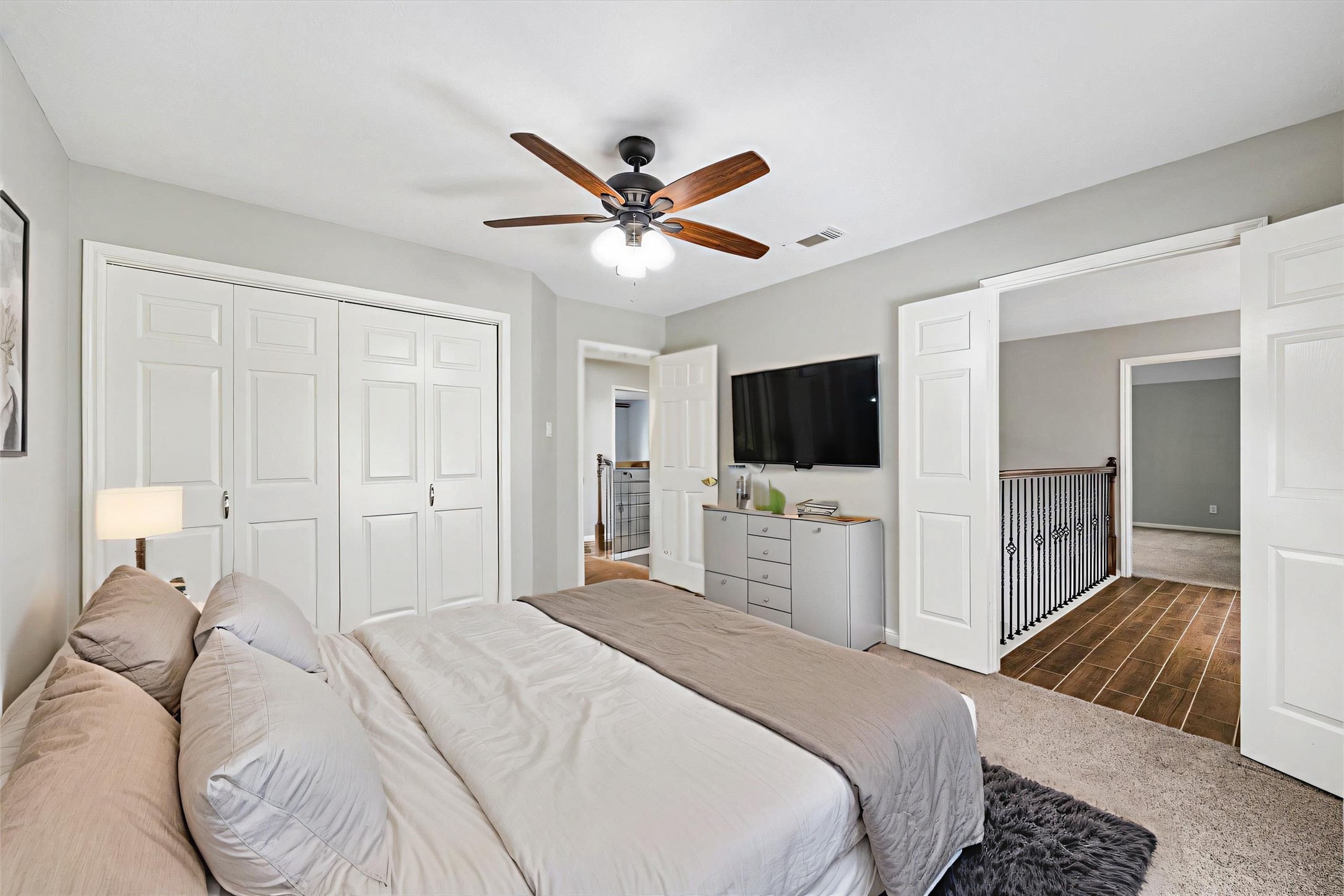 2006 Raven's Crest Drive Sugar Land, TX 77478 - Photo 21 of 29 a bedroom with a bed and a flat screen tv