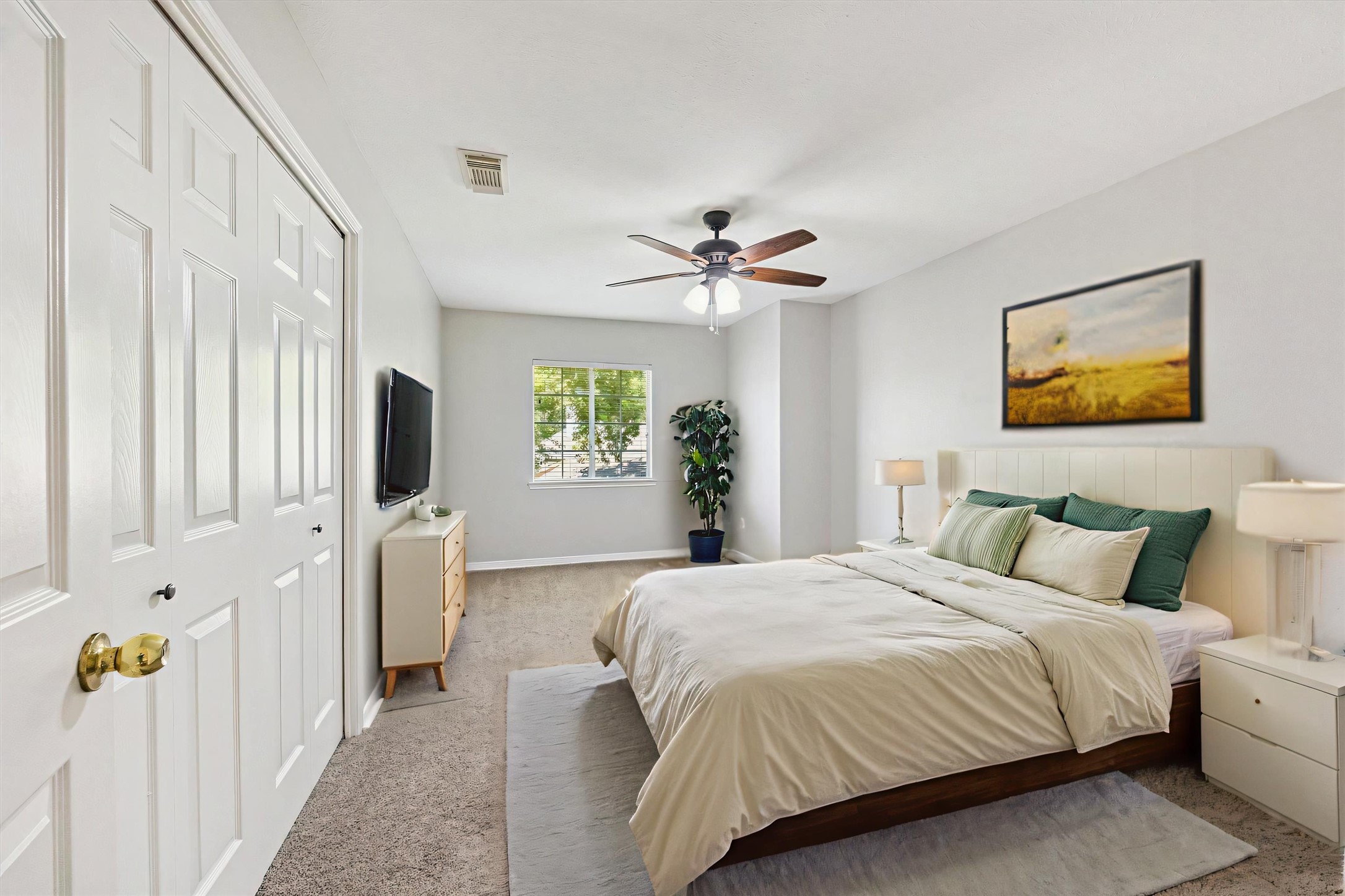 2006 Raven's Crest Drive Sugar Land, TX 77478 - Photo 22 of 29 a bedroom with a bed and a chandelier