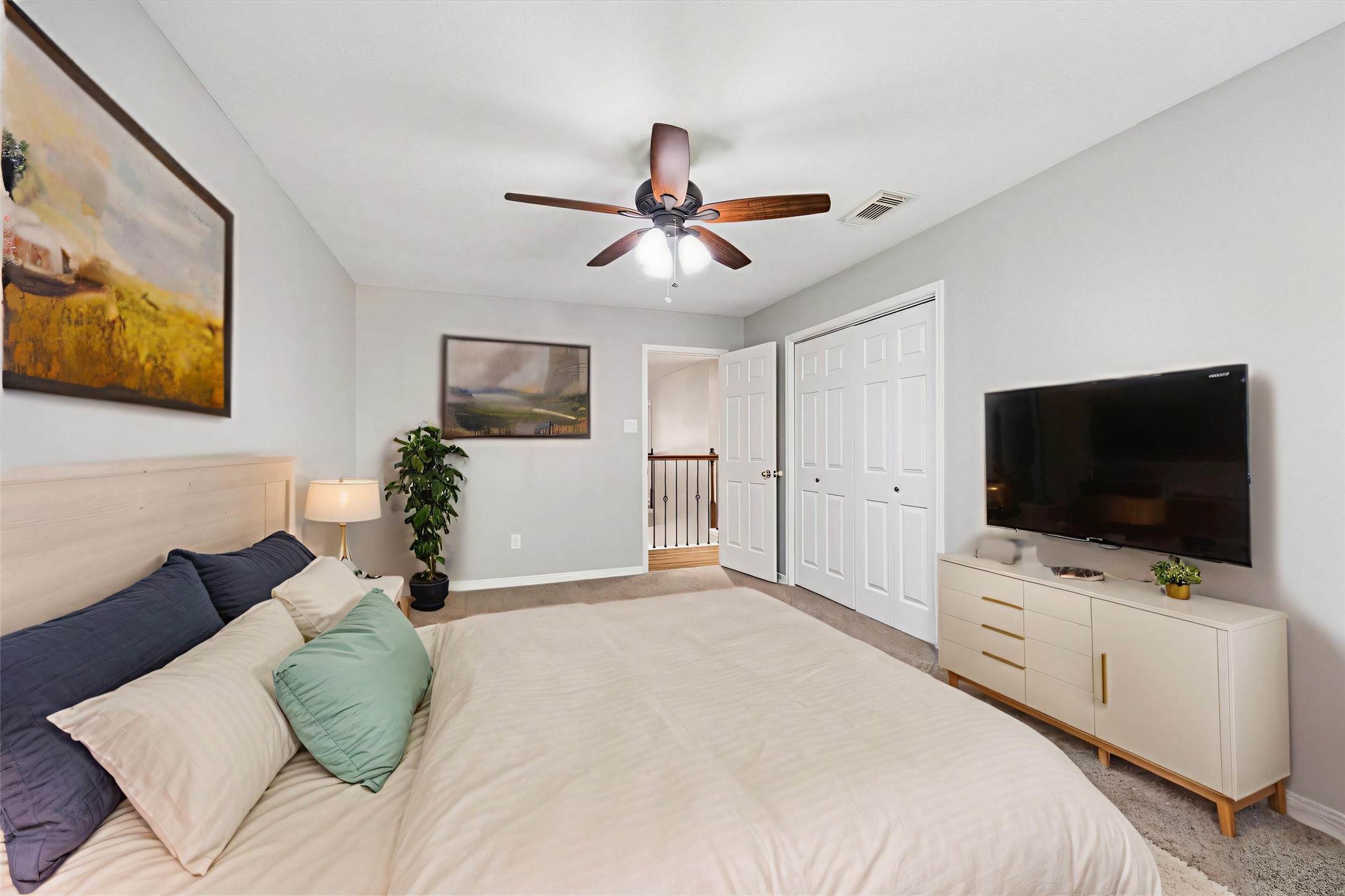 2006 Raven's Crest Drive Sugar Land, TX 77478 - Photo 23 of 29 a bedroom with a bed window and a flat screen tv