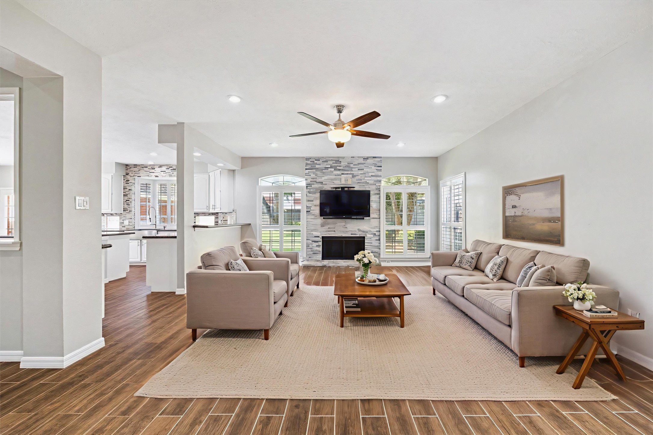 2006 Raven's Crest Drive Sugar Land, TX 77478 - Photo 6 of 29 a living room with furniture fireplace and a large window