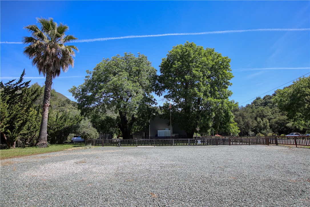 15050 Morro Road Atascadero, CA 93422 - Photo 32 of 33 a view of a house with a yard and palm trees