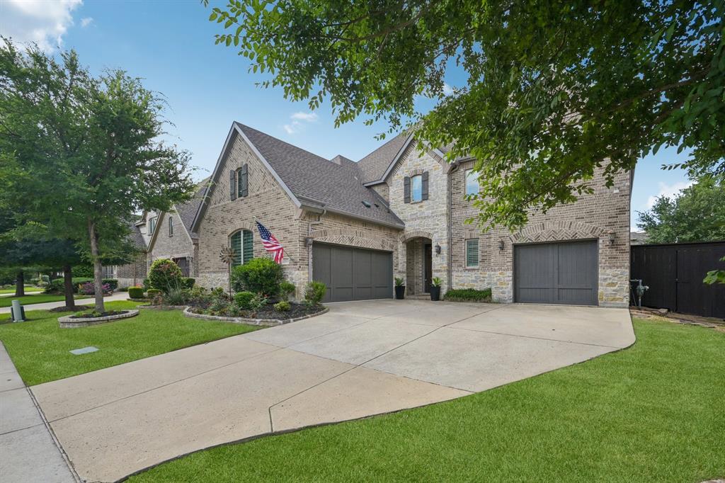 2029 Temperate Drive Allen, TX 75013 - Photo 2 of 40 a front view of a house with a garden and yard