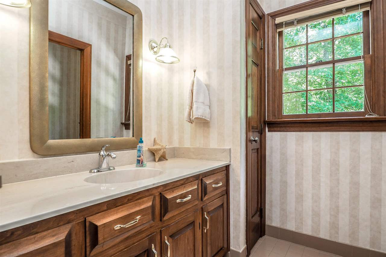 5009 Field And Stream Road Raleigh, NC 27613 - Photo 11 of 12 Bathroom has a GRANITE vanity with great natural surroundings. Bathroom