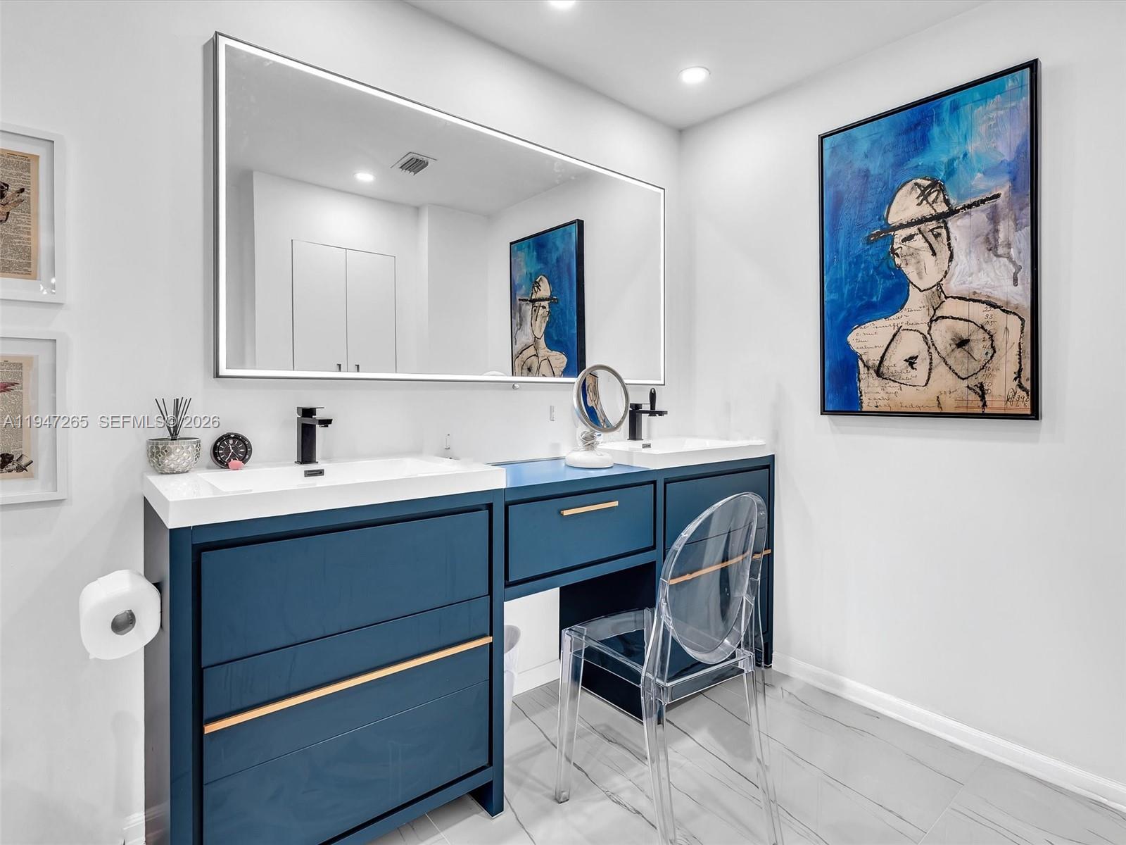 7661 Southwest 102nd Place Miami, FL 33173 - Photo 19 of 51 a bathroom with a sink and a mirror