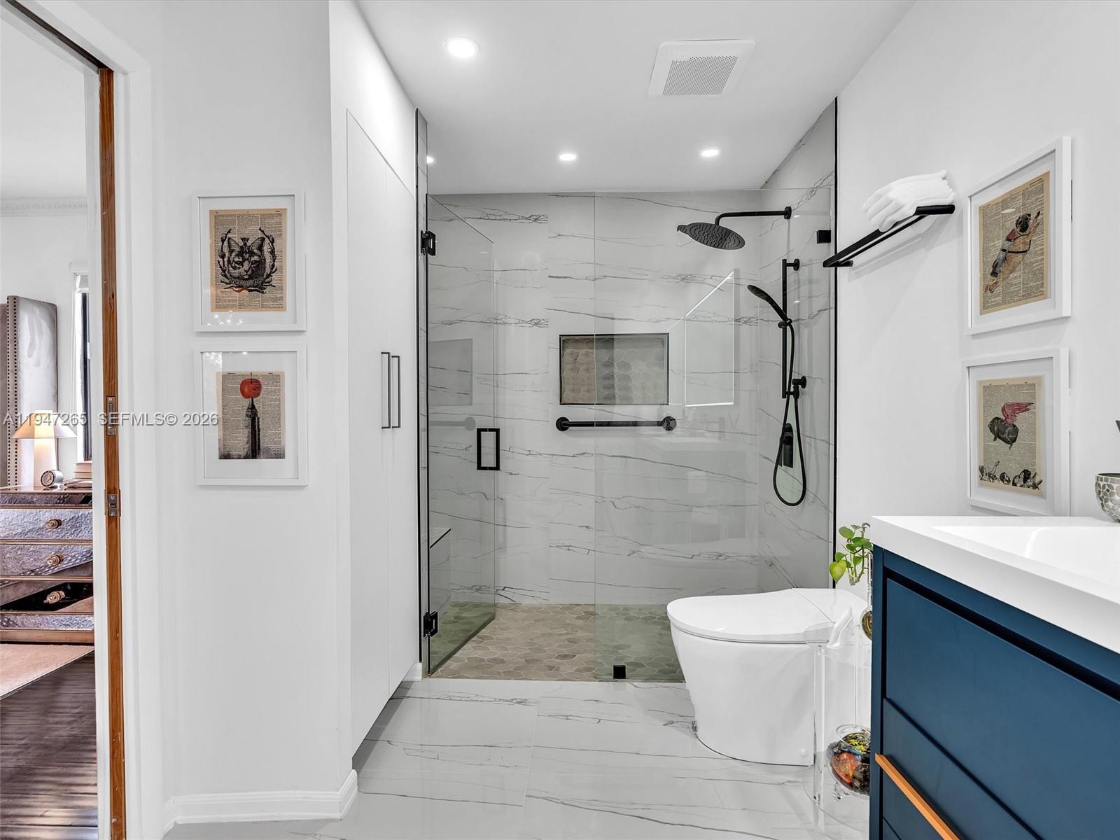 7661 Southwest 102nd Place Miami, FL 33173 - Photo 20 of 51 a bathroom with a sink a toilet and shower