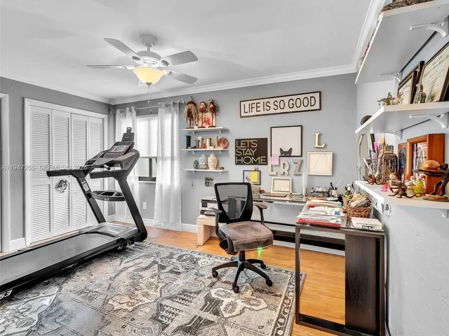 a bathroom with a granite countertop toilet sink and mirror