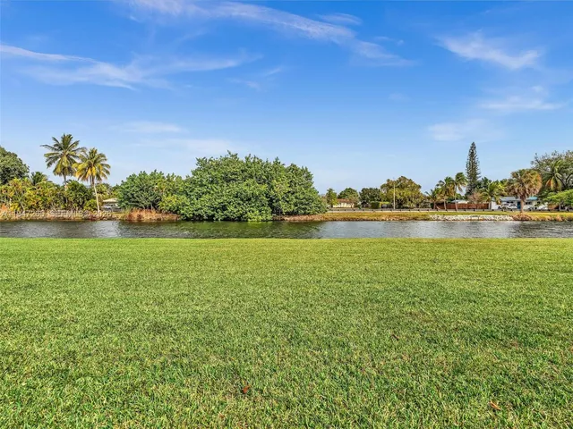 a living room with furniture a window and gym equipment