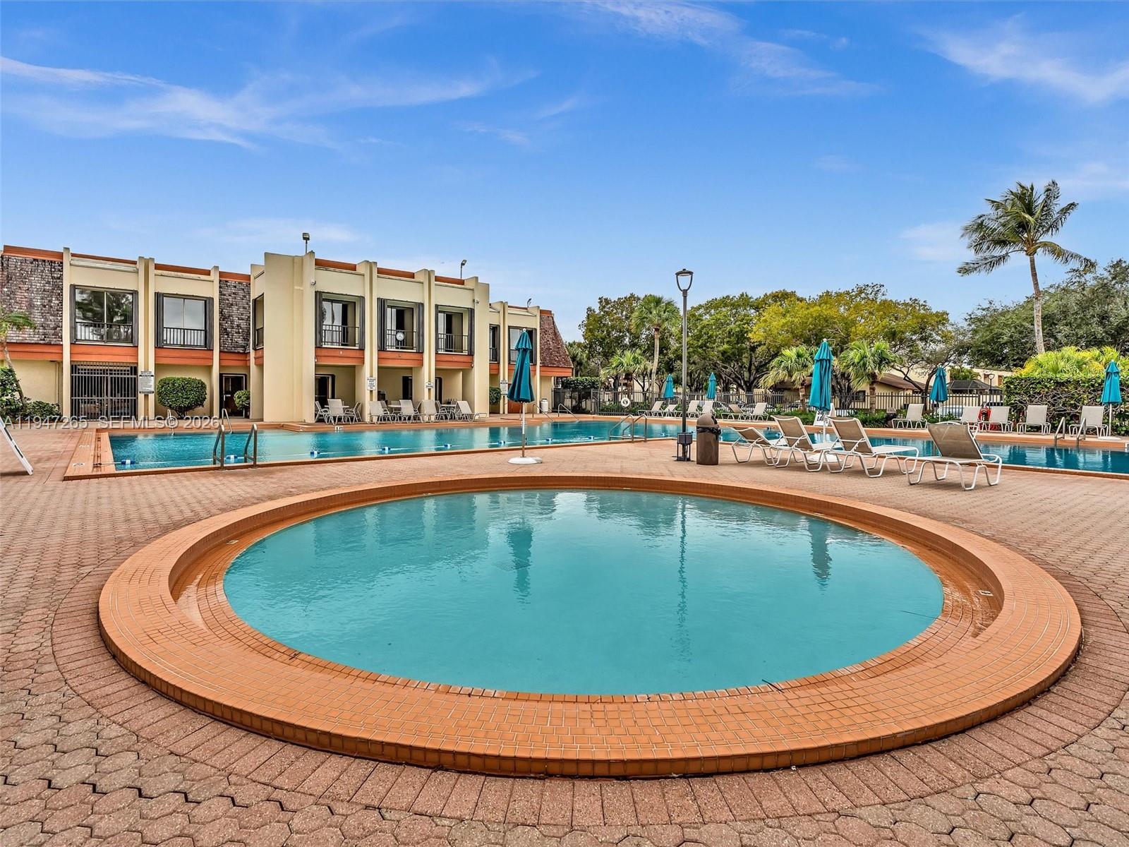 7661 Southwest 102nd Place Miami, FL 33173 - Photo 41 of 51 a view of outdoor space yard swimming pool and patio