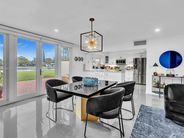 a living room with furniture and a dining room