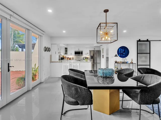 a kitchen with kitchen island granite countertop counter top space a sink and cabinets
