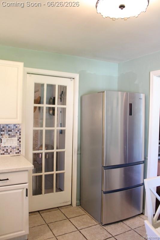 8951 Stevens Street Taylor, MI 48180 - Photo 12 of 32 PREMIUM STAINLESS STEEL REFRIGERATOR AND THE KITCHEN HAS 2 HANDY POCKET STYLE DOORS – 1 TO THE LIVING ROOM + 1 TO THE LAUNDRY ROOM!