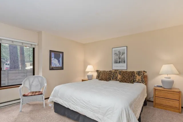 a bedroom with a bed and a lamp