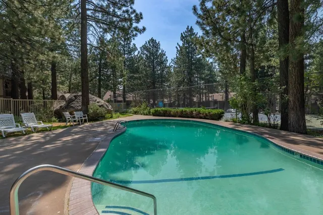 a view of a swimming pool with a patio