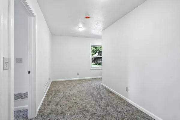 an empty room with windows