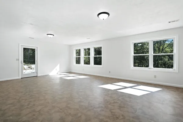 an empty room with windows