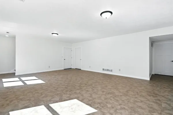 a view of an empty room and window