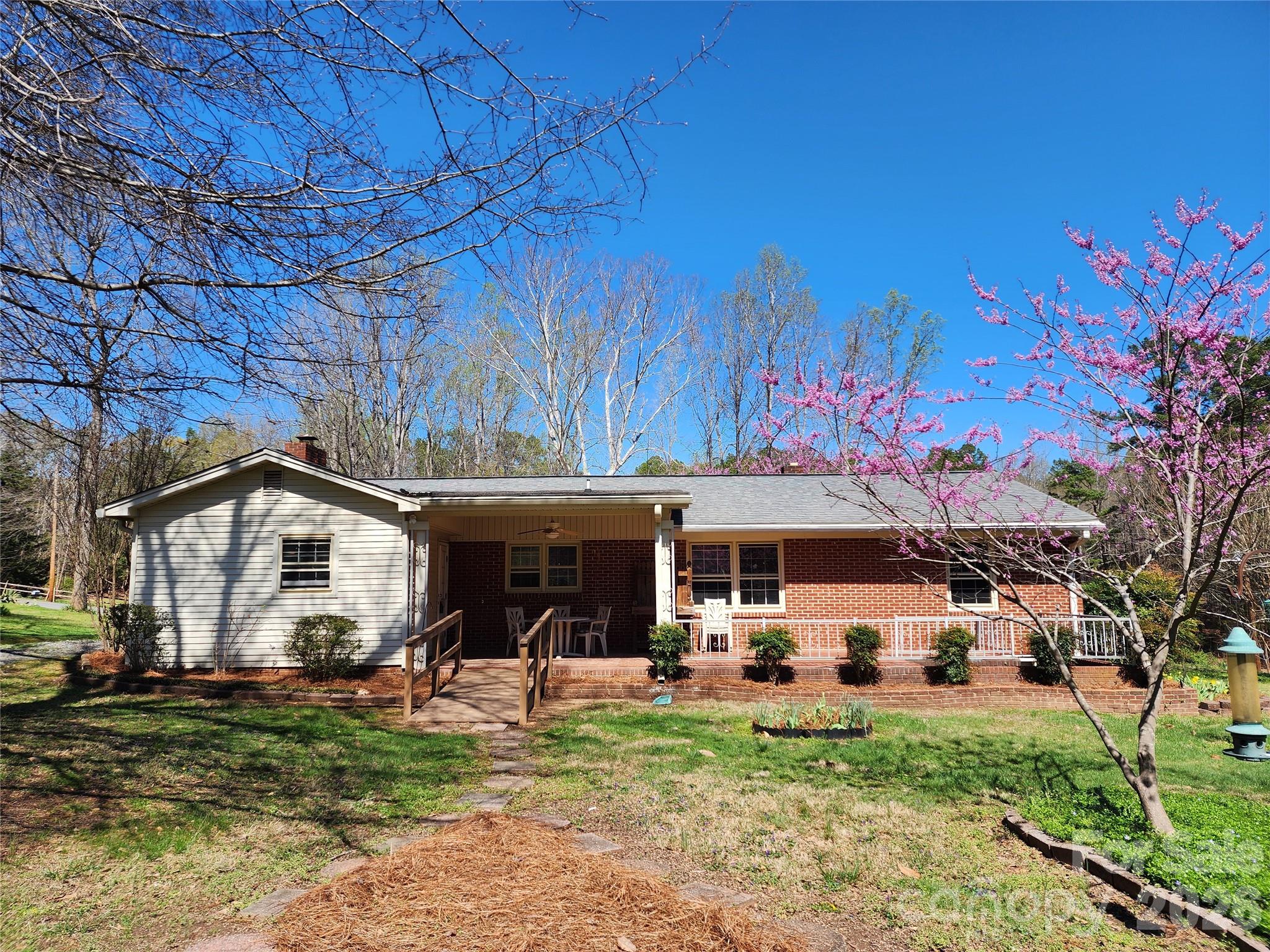 217 St John Street Dallas, NC 28034 - Photo 2 of 34 a front view of a house with garden