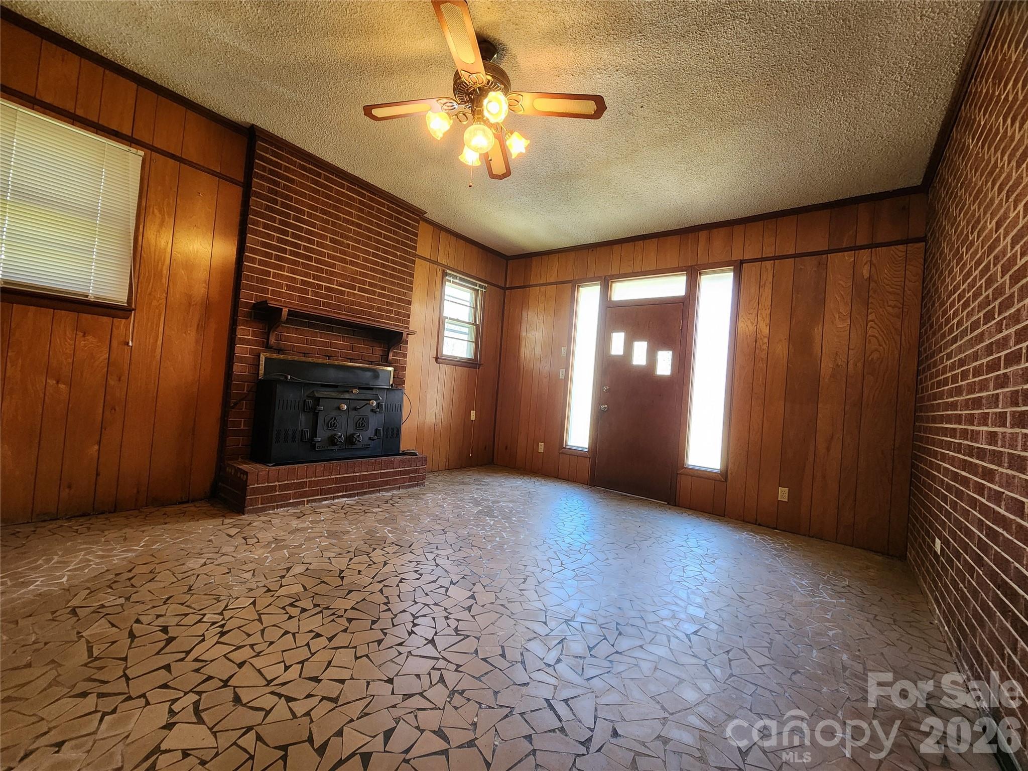 217 St John Street Dallas, NC 28034 - Photo 9 of 34 a view of empty room with window and fireplace