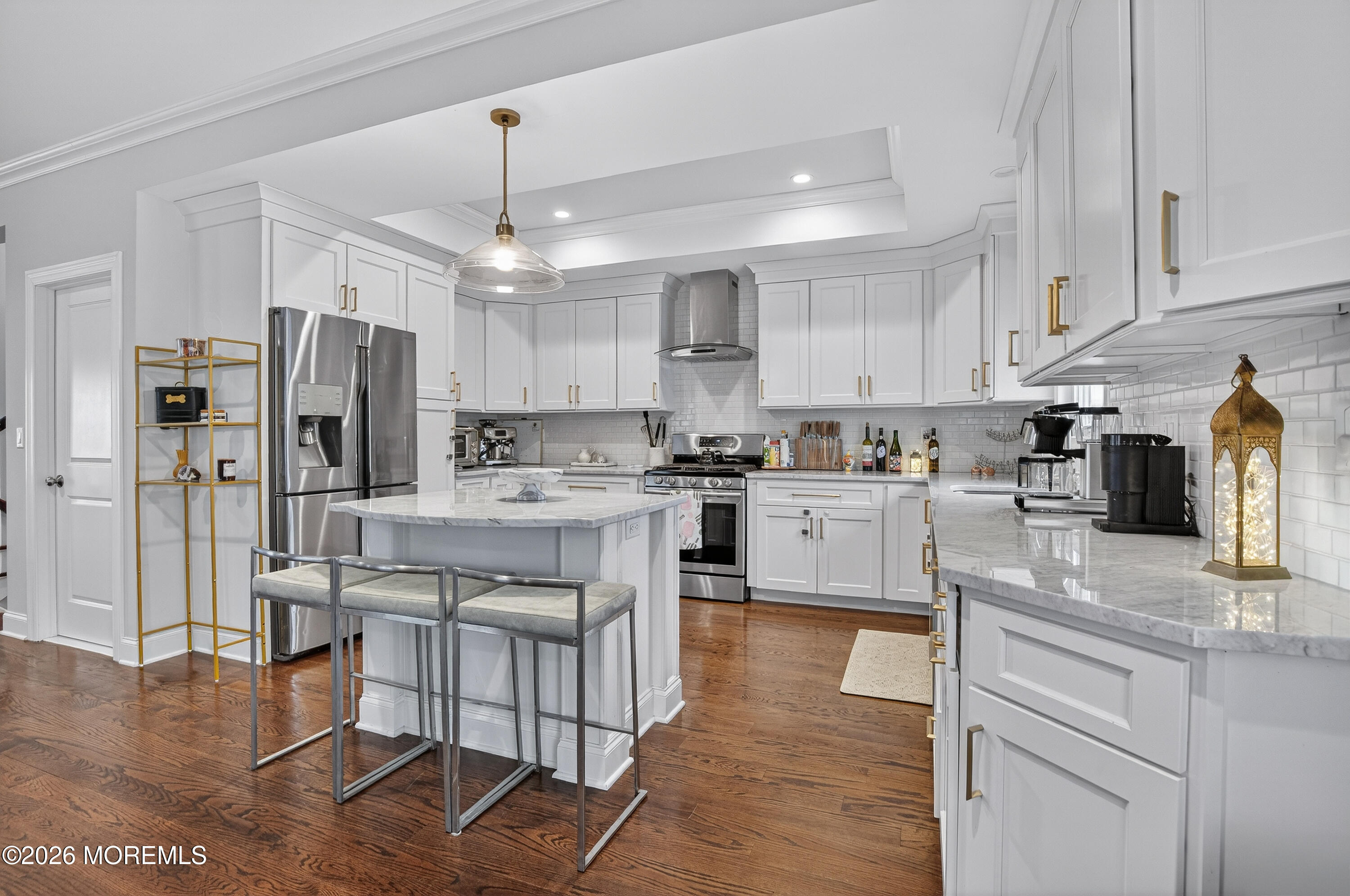27 5th Street Highlands, NJ 07732 - Photo 5 of 62 a kitchen with stainless steel appliances granite countertop a refrigerator oven a sink a stove and white cabinets with wooden floor