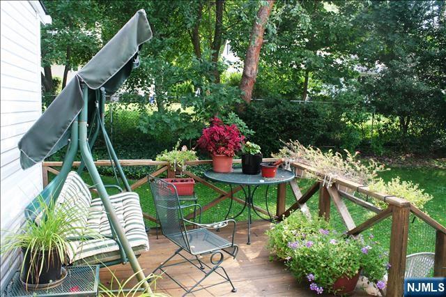 82 Heatherhill Road Cresskill, NJ 07626 - Photo 5 of 9 a view of an chairs and table in the patio
