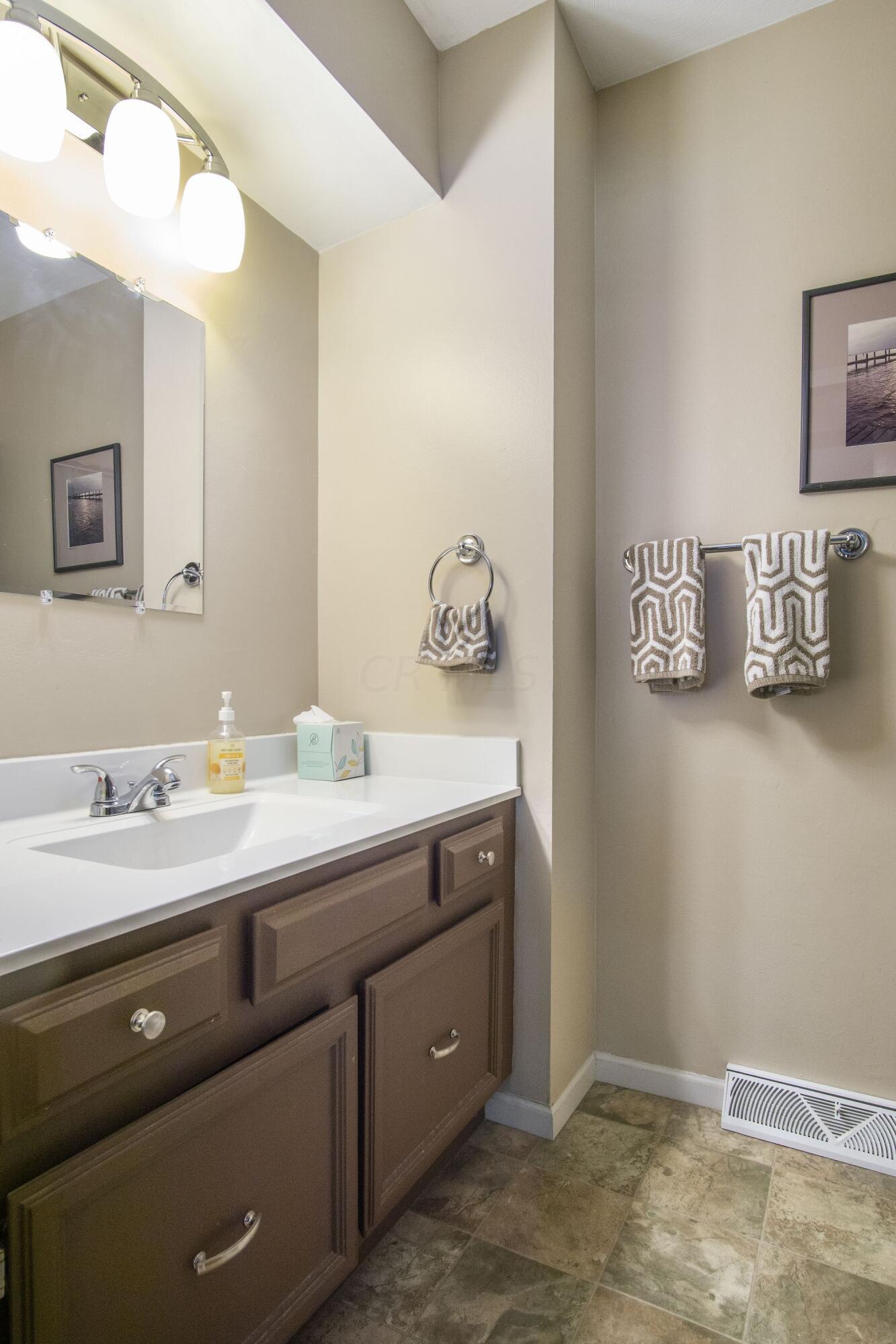 6053 Rocky Rill Road Columbus, OH 43235 - Photo 19 of 28 Full Bath with ceramic tile, vanity tub/shower.