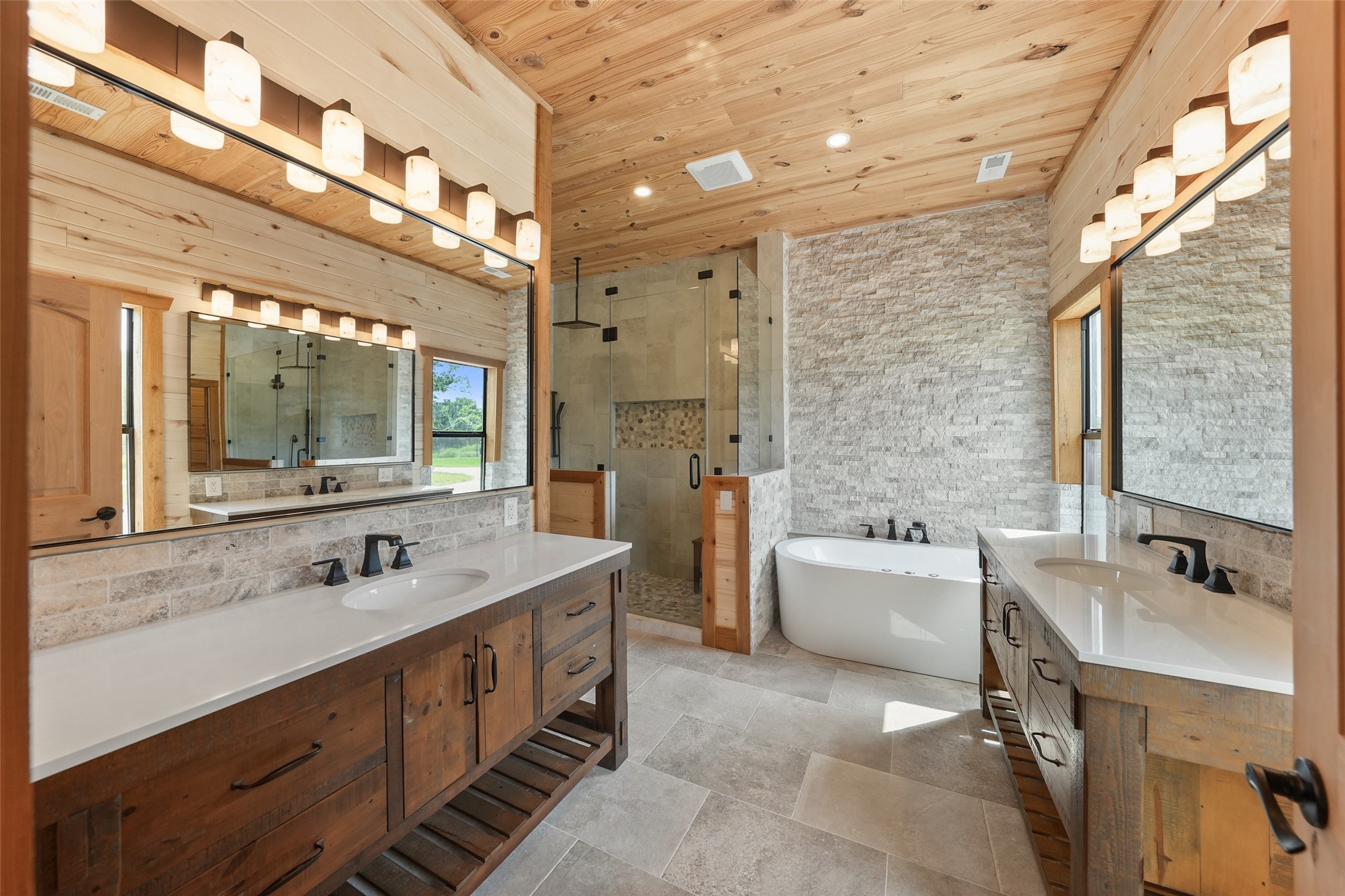 26534 Mitchell Road Hempstead, TX 77445 - Photo 17 of 45 a spacious bathroom with a double vanity sink mirror double and bathtub