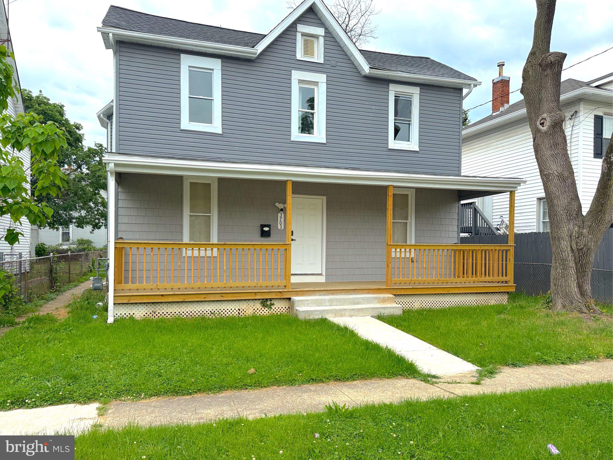 3703 6th Street, Unit 1 Baltimore, MD 21225 - Photo 1 of 12 Charming gray home with inviting porch.