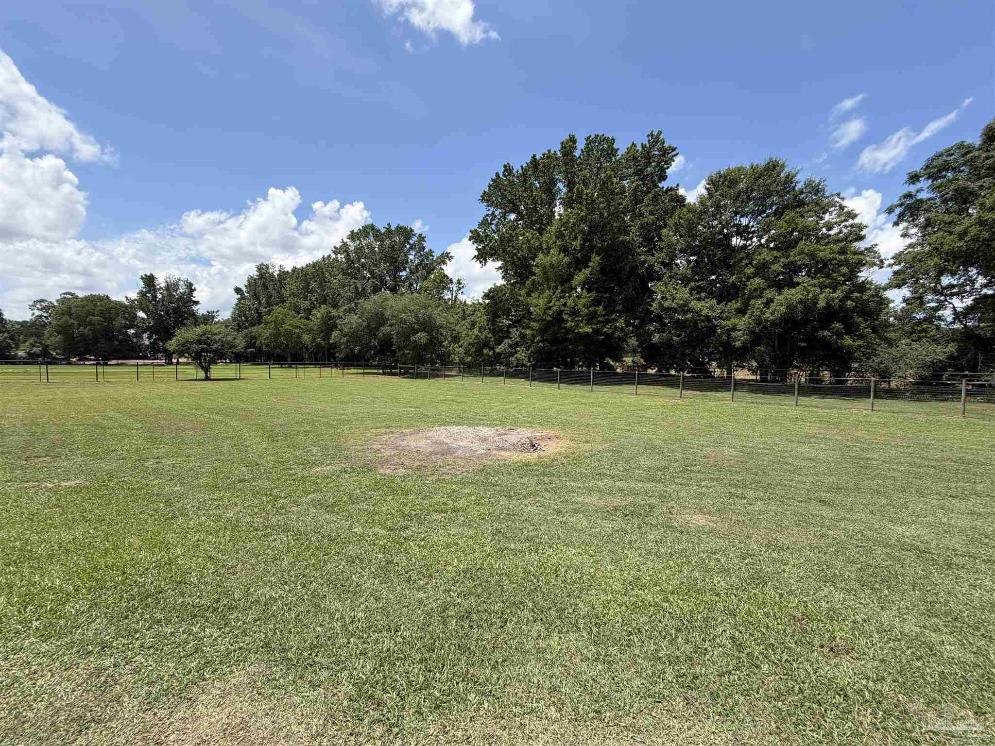 145 Tower Road Uriah, AL 36480 - Photo 46 of 72 a view of a golf course with a lake