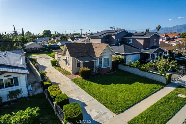 a aerial view of a house with a yard