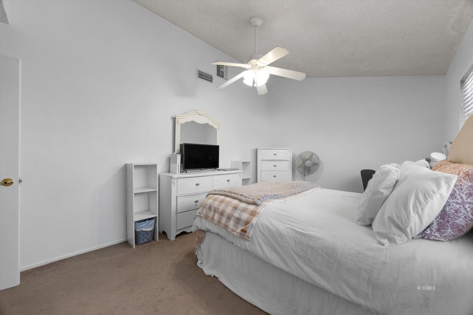 736 Fendrick Circle Ridgecrest, CA 93555 - Photo 37 of 49 a bedroom with a bed and a chandelier