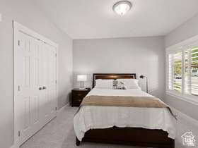 514 North Olympic Way Midway, UT 84049 - Photo 20 of 30 Bedroom featuring plush carpet, white walls, and a window with plantation shutters