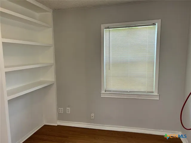 a view of a room that has a window in it