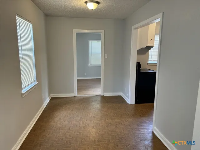 an empty room with windows