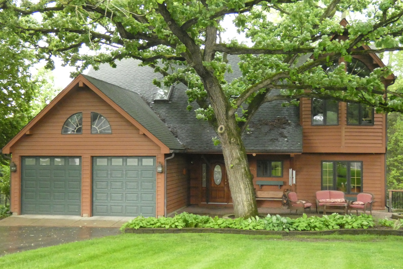 429 High Road Cary, IL 60013 - Photo 1 of 13 a front view of a house with garden