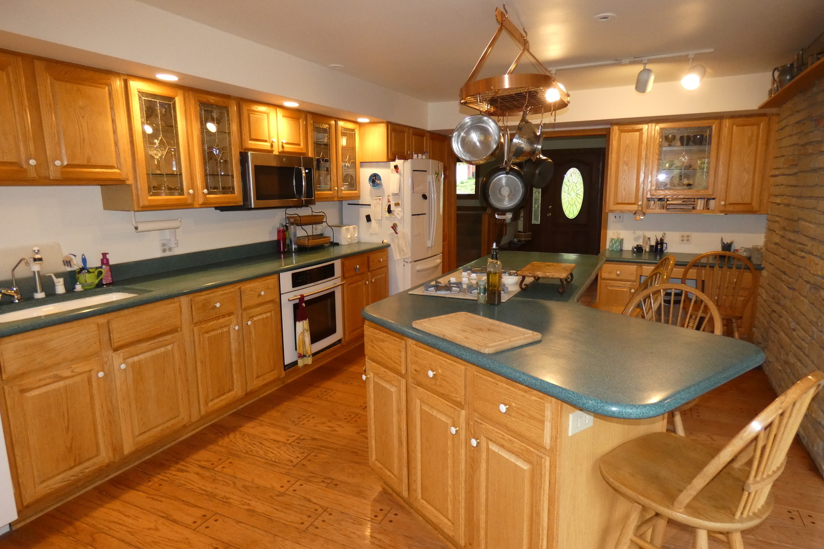 429 High Road Cary, IL 60013 - Photo 2 of 13 a kitchen with stainless steel appliances granite countertop a sink a stove counter space and cabinets