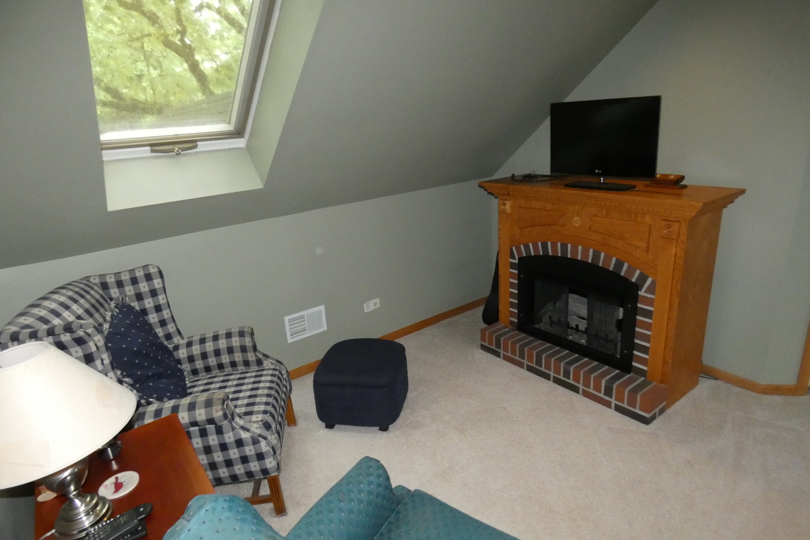 429 High Road Cary, IL 60013 - Photo 12 of 13 a living room with furniture and a fireplace
