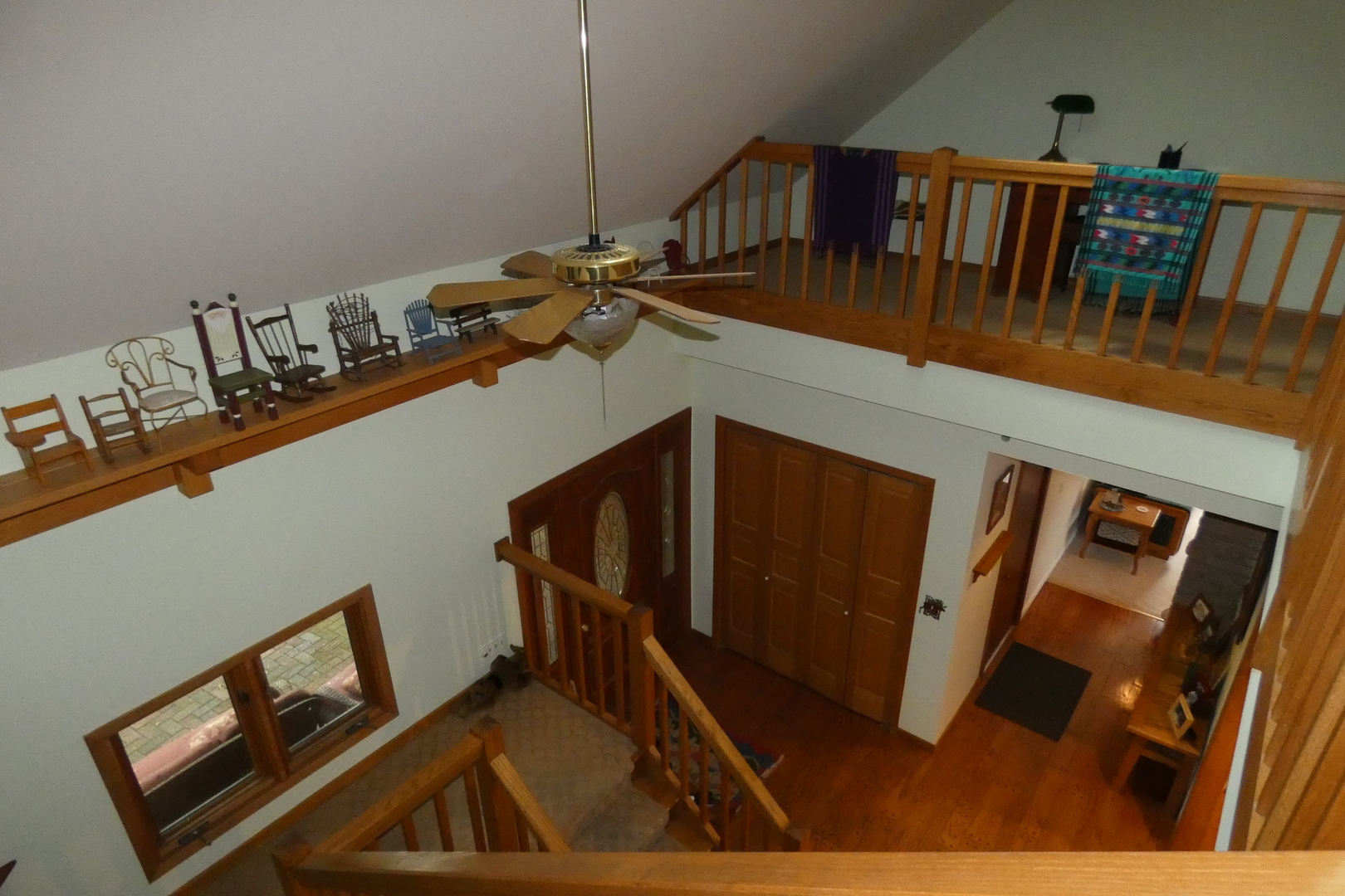 429 High Road Cary, IL 60013 - Photo 13 of 13 a view of staircase with lots of frames on wall and a window