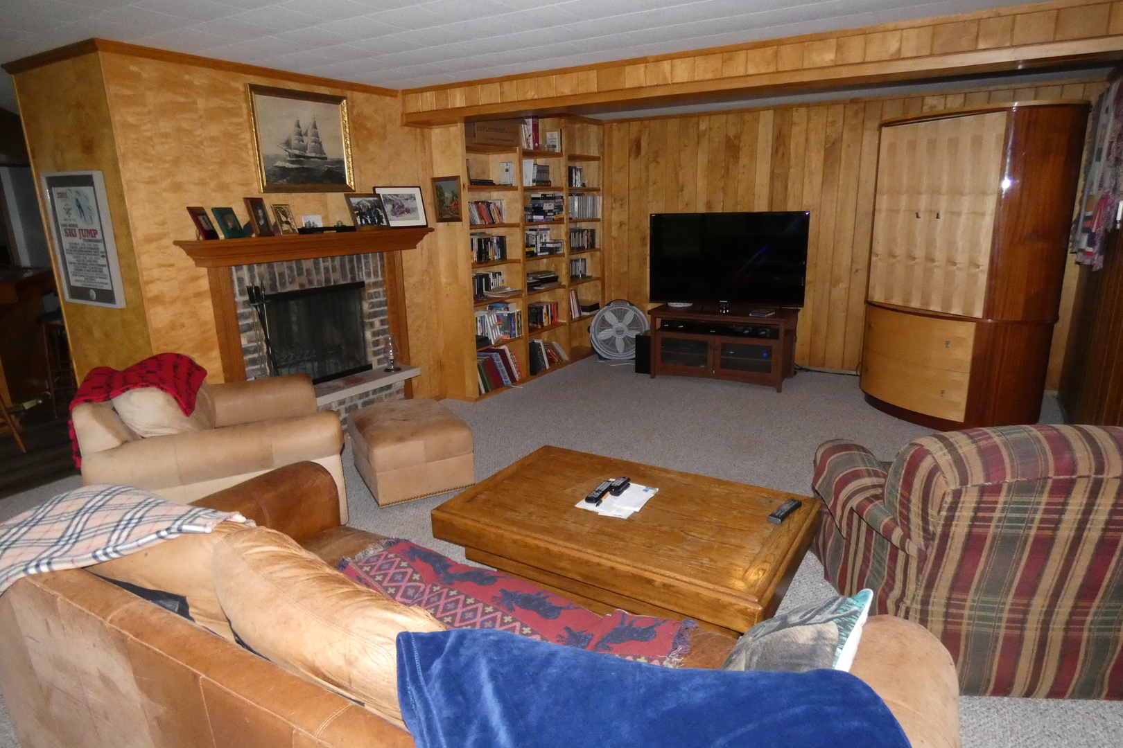 429 High Road Cary, IL 60013 - Photo 8 of 13 a living room with furniture a flat screen tv and a fireplace
