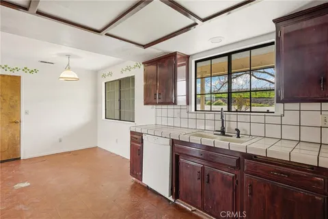 a kitchen with a sink and a window
