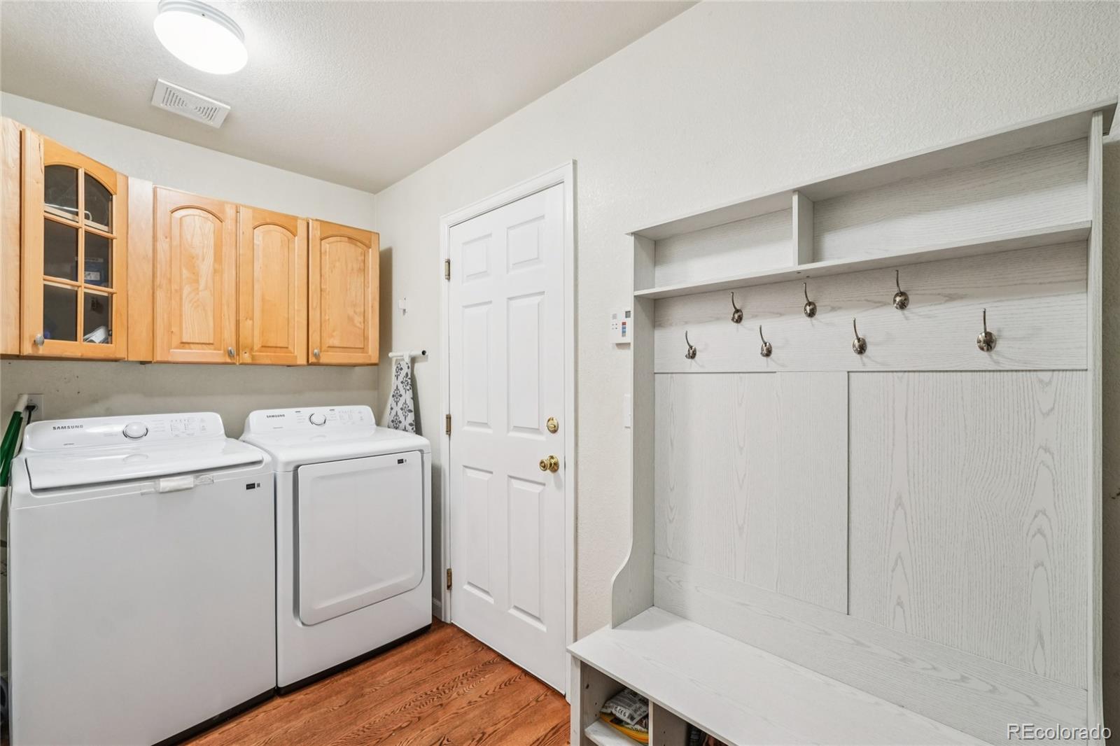 9230 Cook Street Thornton, CO 80229 - Photo 17 of 34 a view of a storage & utility room with closet dryer and washer