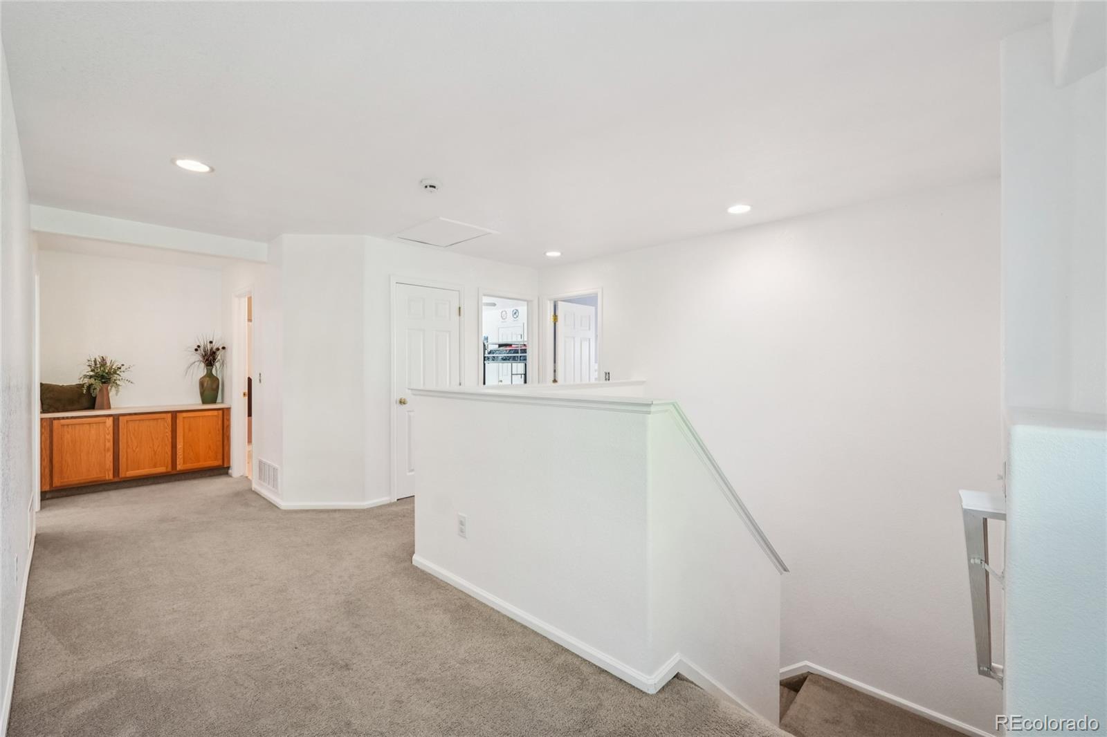 9230 Cook Street Thornton, CO 80229 - Photo 20 of 34 a view of an empty room with wooden floor