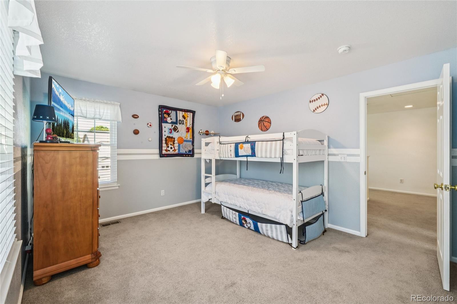 9230 Cook Street Thornton, CO 80229 - Photo 21 of 34 a living room with furniture and a table