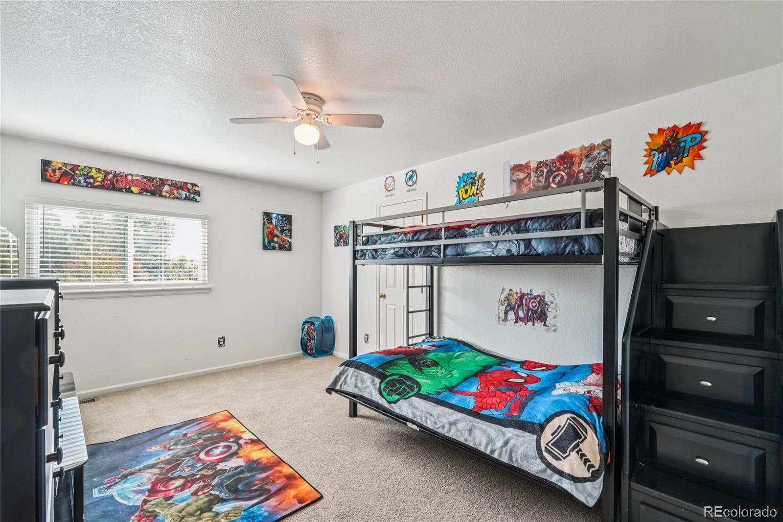 9230 Cook Street Thornton, CO 80229 - Photo 23 of 34 a bedroom with a bed and a chandelier