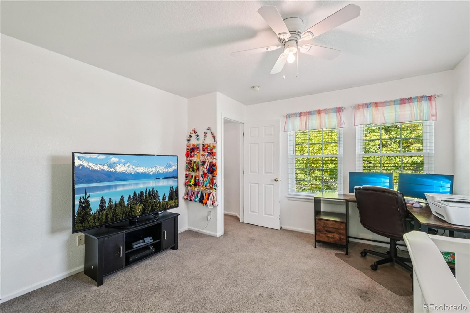 9230 Cook Street Thornton, CO 80229 - Photo 26 of 34 a view of a livingroom with workspace and a window