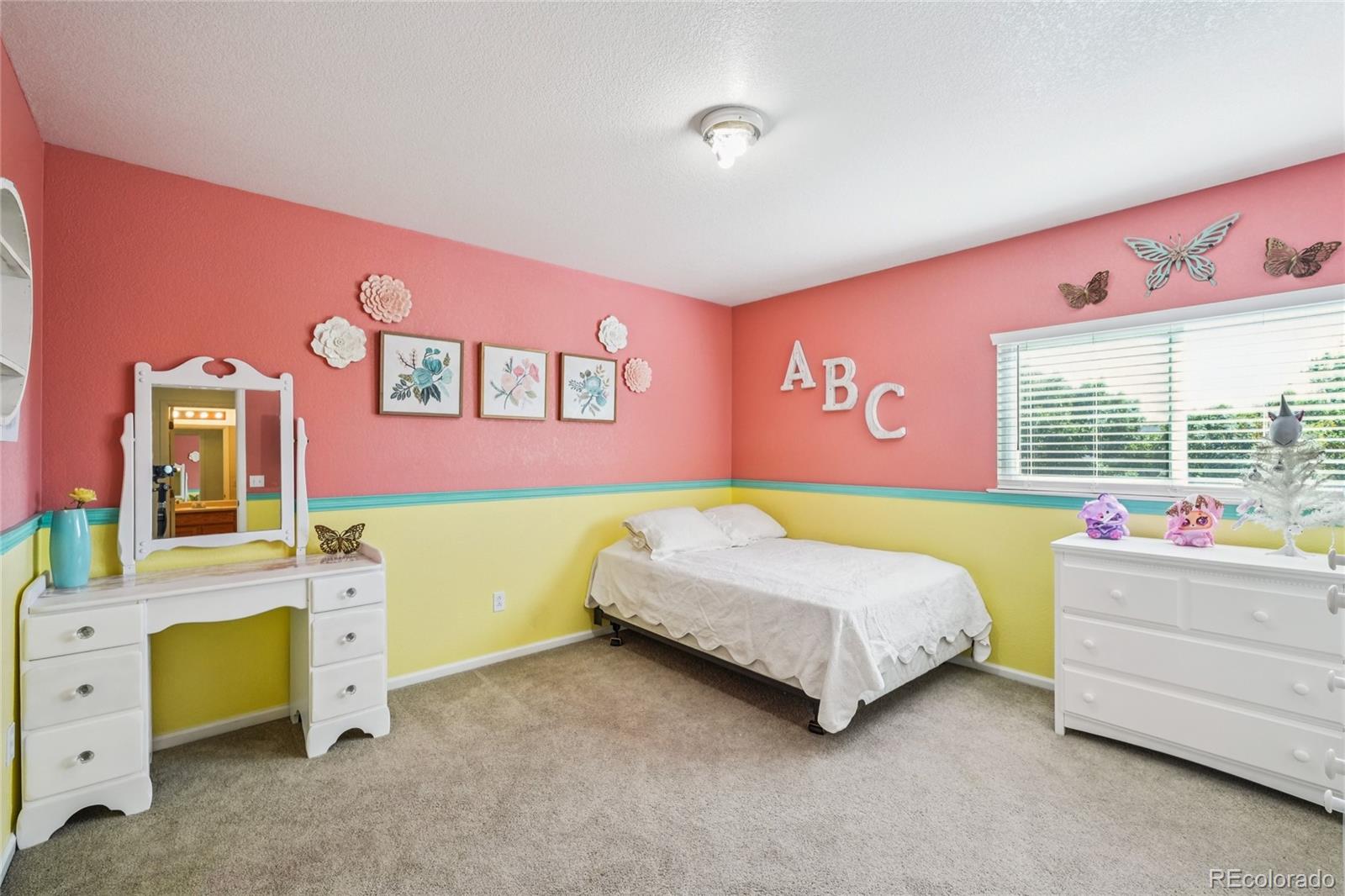 9230 Cook Street Thornton, CO 80229 - Photo 27 of 34 a bedroom with a bed and a window