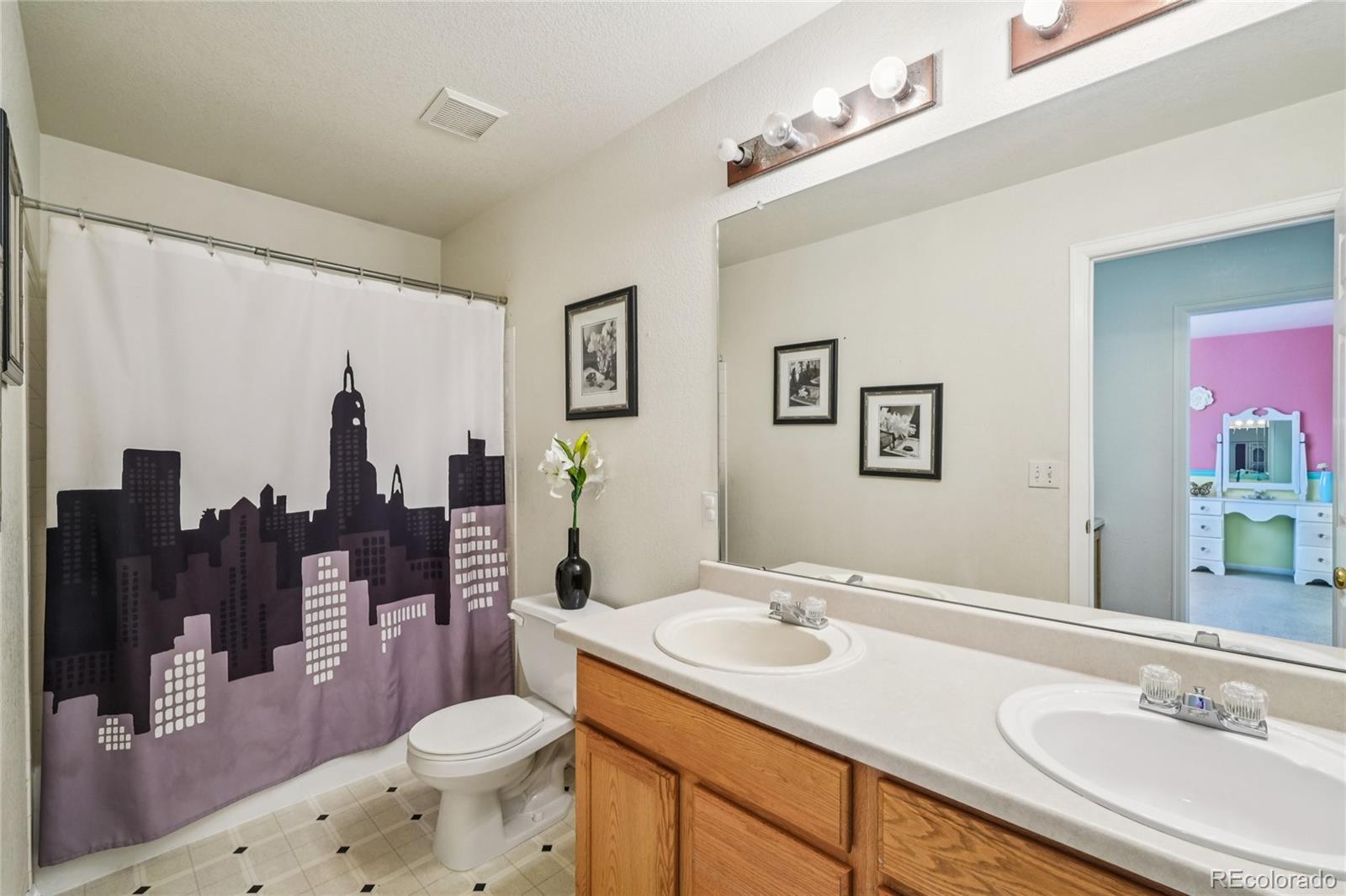 9230 Cook Street Thornton, CO 80229 - Photo 29 of 34 a bathroom with a sink vanity granite and toilet