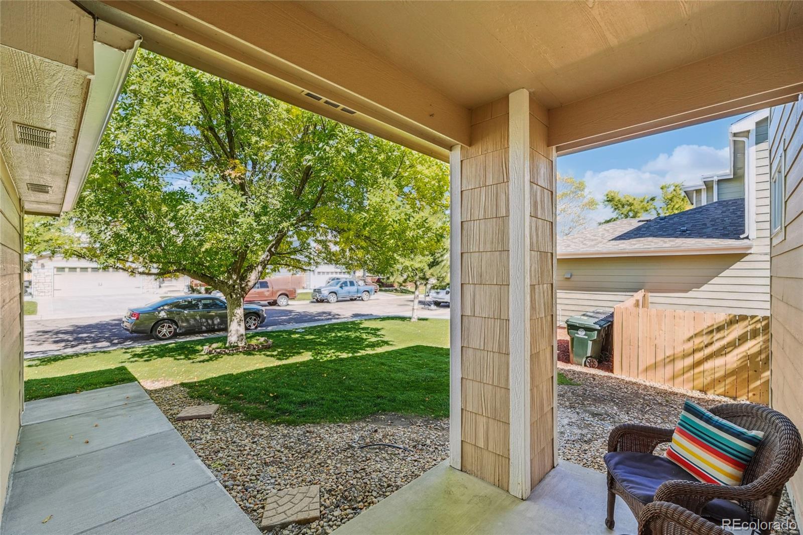 9230 Cook Street Thornton, CO 80229 - Photo 3 of 34 a view of a porch with a yard